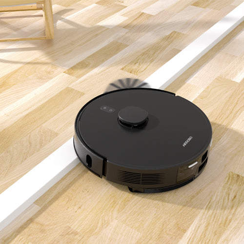 AIRROBO robot vacuum cleaner navigating across light wooden floor with side brushes visible in cleaning mode